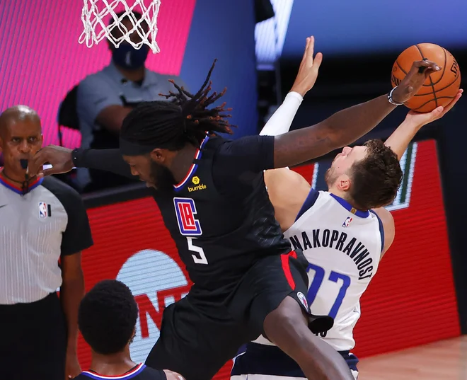 Luka Dončič je uprizoril nov šov pod obroči. FOTO: Kevin C. Cox/AFP