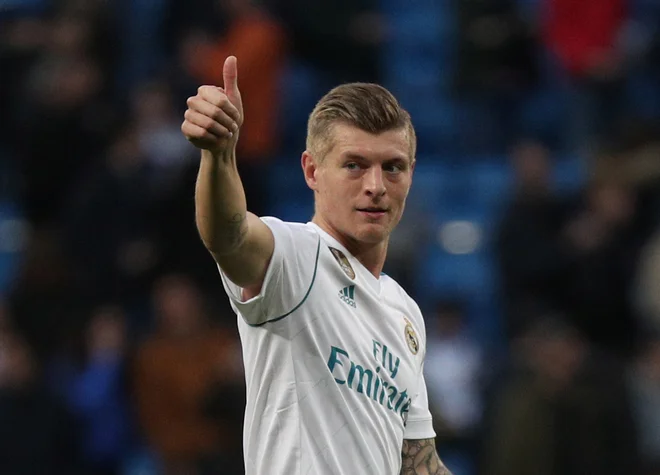 Toni Kroos se je letos v Kijevu razveselil že četrte lovorike v ligi prvakov. Foto Reuters