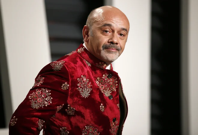 Christian Louboutin pričakuje ekskluzivo za rdeče podplate. FOTO: Reuters