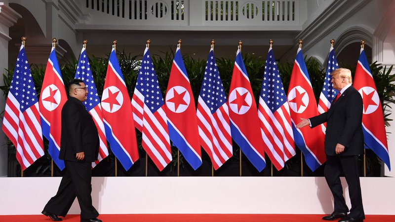 Fotografija: Donald Trump in Kim Džong Un FOTO AFP
