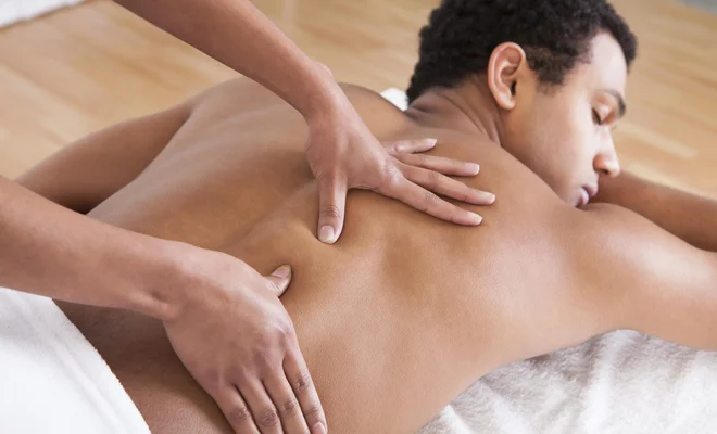 Man Receiving Massage From Female Hand