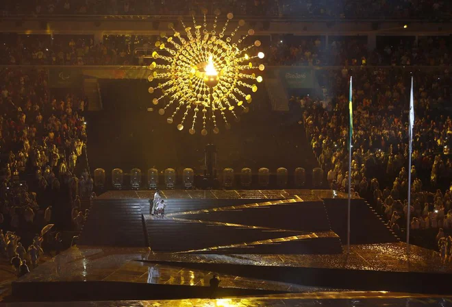 Brazilian athlete Clodoaldo da Silva wheels down stage after lighting the olympic flame during the opening ceremony of the Rio 2016 Paralympic Games at Maracana Stadium in Rio de Janeiro, Brazil, Wednesday, Sept. 7, 2016. (AP Photo/Silvia Izquierdo)