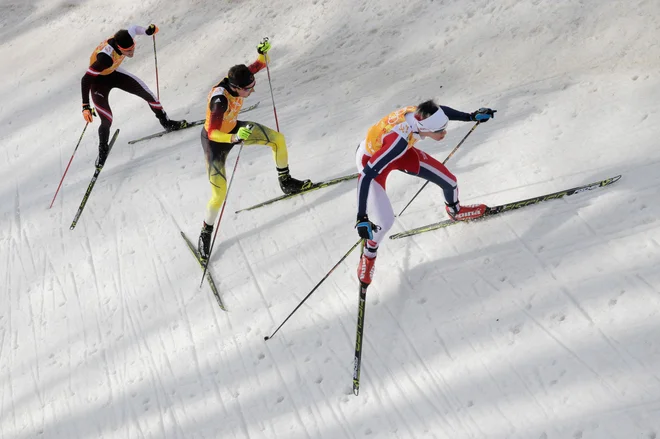 SOCHI, RUSSIA - FEBRUARY 20: (L-R) Bernhard Gruber of Austria, Johannes Rydzek of Germany and Magnus Krog of Norway compete in the Nordic Combined Men's Team 4 x 5 km during day 13 of the Sochi 2014 Winter Olympics at RusSki Gorki Jumping Center on Februa