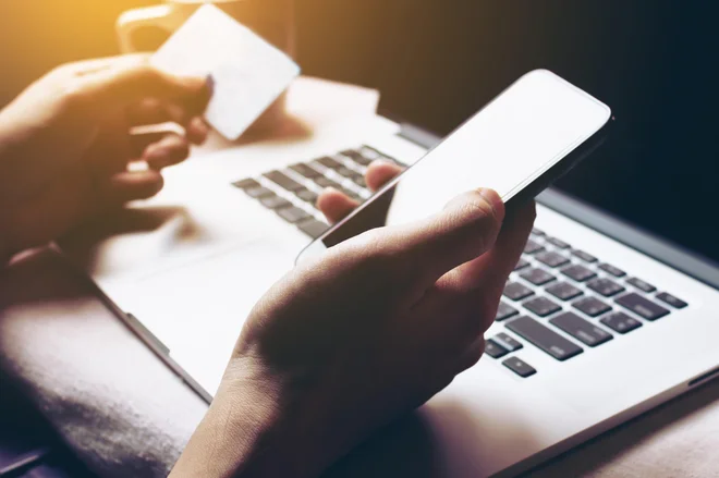 Woman using smartphone and login internet banking for shopping online.