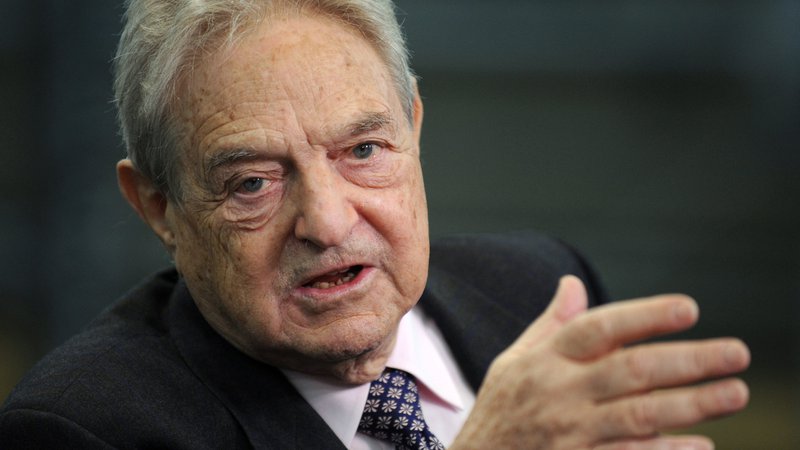 Fotografija: George Soros, 87-letni milijarder, je eden najbolj znanih investitorjev na svetu. FOTO: Axel Schmidt/AFP