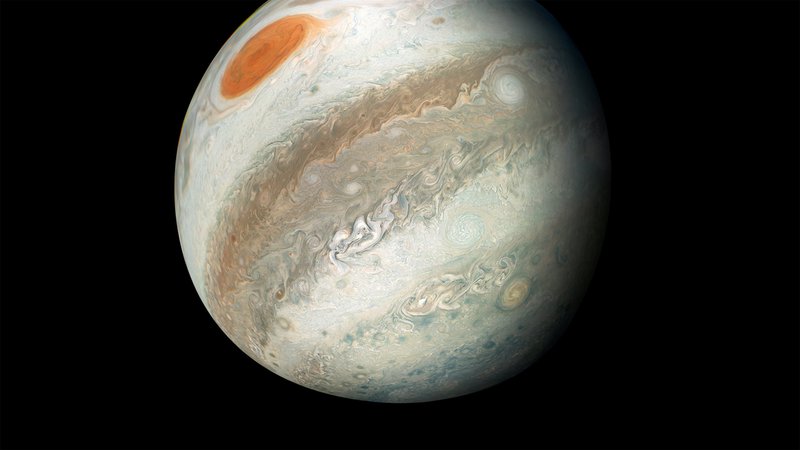 Fotografija: Barviti Jupiter ima v bližini svoje poti tudi sopotnika, ki potuje v obratno smer. Asteroidnega kamikaza so znanstveniki odkrili pred kratkim. FOTO: Nasa/Reuters