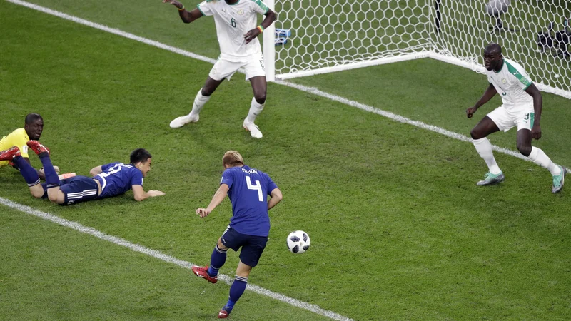 Fotografija: Keisuke Honda je vskočil z rezervne klopi in Japonski zagotovil točko. Foto Mark Baker/AP