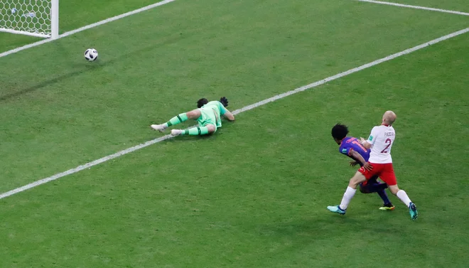 Juan Cuadrado je potrdil kolumbijsko zmago. Foto Jorge Silva/Reuters