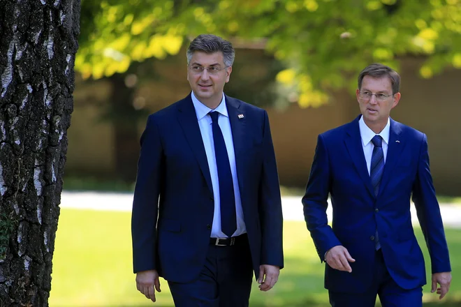 Miro Cerar in Andrej Plenković. FOTO: Tomi Lombar/Delo