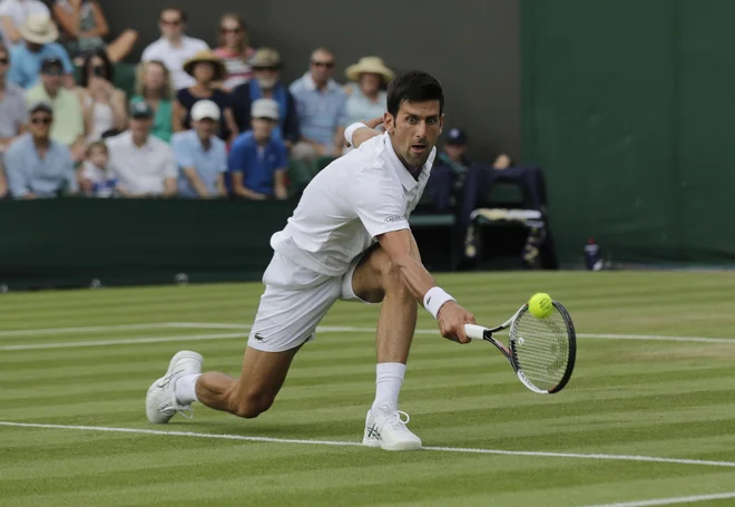 Novak Đoković je v dveh dvobojih skupaj oddal le 12 iger. Foto Ben Curtis/AP