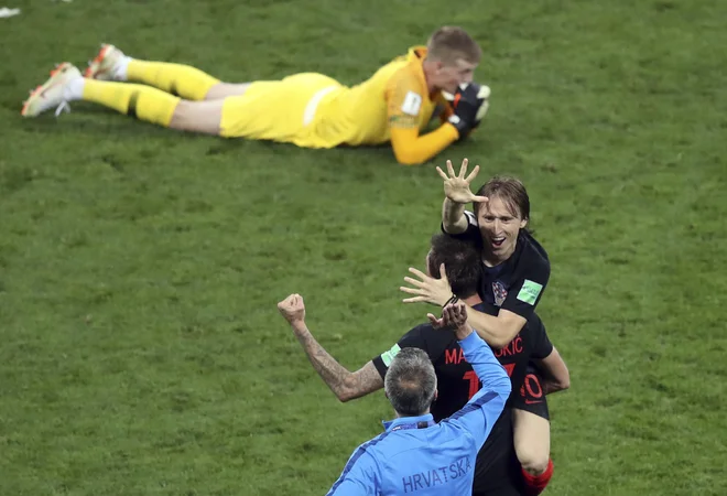 Veselje in žalost. FOTO: Thanassis Stavrakis/Ap