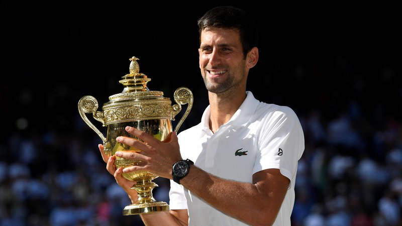 Fotografija: Novak Đoković je četrtič osvojil turnir v Wimbledonu.
Foto Reuters