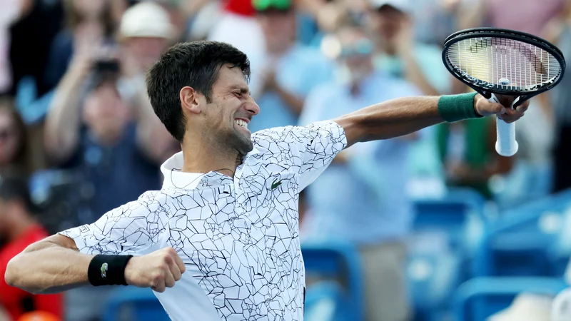 Fotografija: Novak Đoković se je zmage nepopisno razveselil. FOTO: Rob Carr/AFP