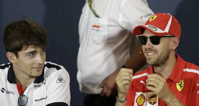 Charles Leclerc (levo) in Sebastian Vettel bosta po novem moštvena tekmeca. FOTO: AP