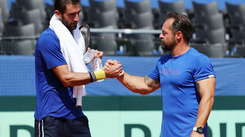 Fotografija: Prvi hrvaški lopar Marin Čilić in kapetan Željko Krajan, sicer tudi trener Polone Hercog, sta optimistična pred polfinalom.
Foto Reuters