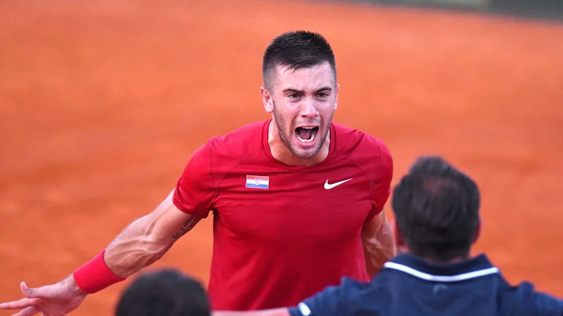 Fotografija: Borna Ćorić je tretjič Hrvaški priigral odločilno točko v peti partiji.
Foto AFP