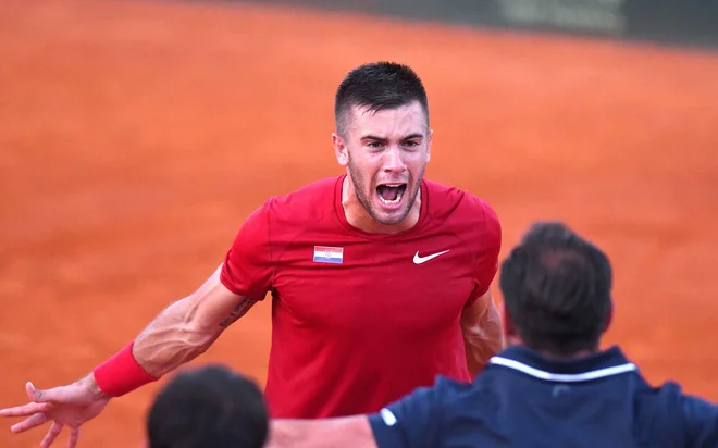 Borna Ćorić je tretjič Hrvaški priigral odločilno točko v peti partiji.<br />
Foto AFP