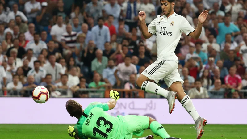 Fotografija: Jan Oblak je tretjič zapored ostal nepremagan. FOTO: Sergio Perez/Reuters