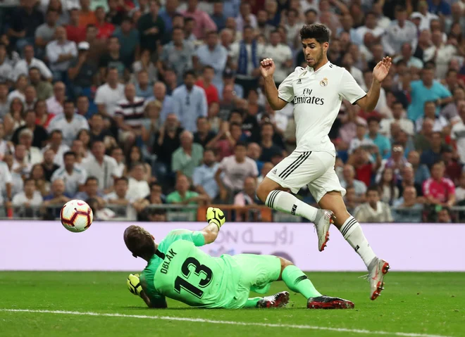 Jan Oblak je tretjič zapored ostal nepremagan. FOTO: Sergio Perez/Reuters