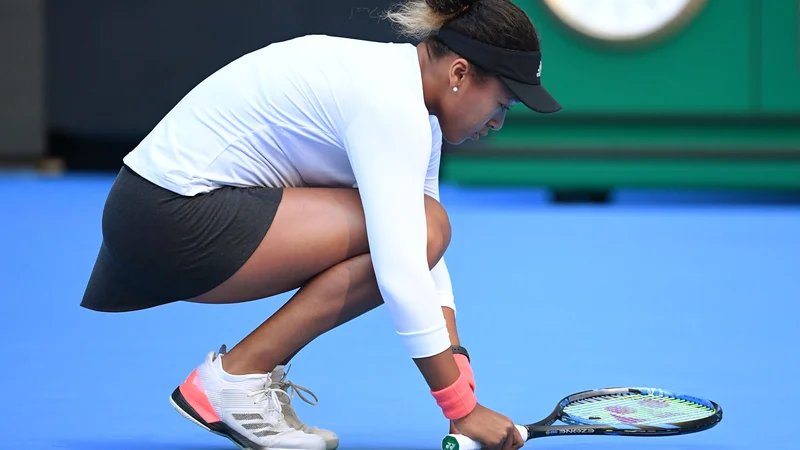 Fotografija: Naomi Osaka je imela težave s hrbtom že v Pekingu. FOTO: Greg Baker/AFP