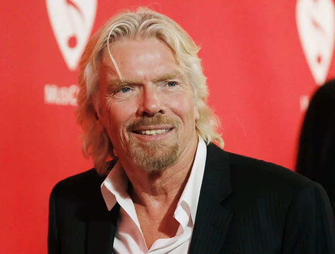 Sir Richard Branson je prepričan, da ne bo preteklo veliko vode do trenutka, ko ga bo njegovo vesoljsko letalo popeljalo v vesolje. FOTO: Danny Moloshok/Reuters