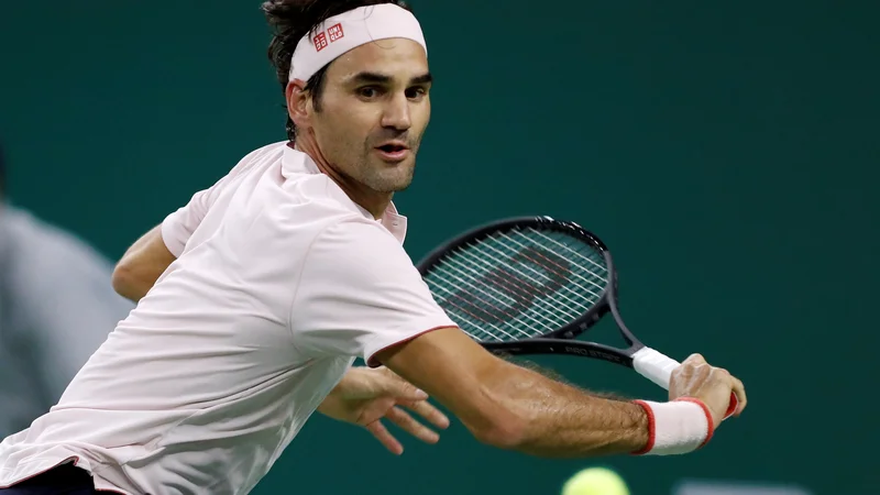 Fotografija: Roger Federer je japonskega izzivalca odpravil z 10 asi. FOTO: Aly Song/Reuters