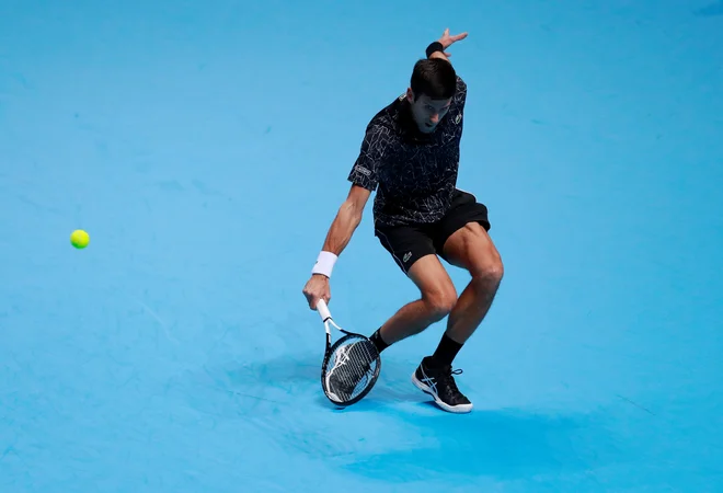 Novak Đoković je zlahka ugnal debitanta Johna Isnerja. FOTO: Reuters