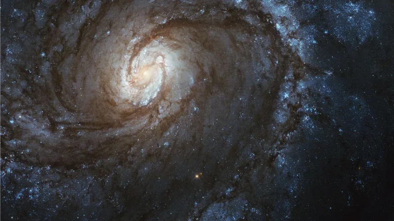 Fotografija: Spiralna galaksija M100, posneta z zadnjo kamero, ki so jo namestili leta 2009. FOTO: NASA, ESA, STScI in Judy Schmidt