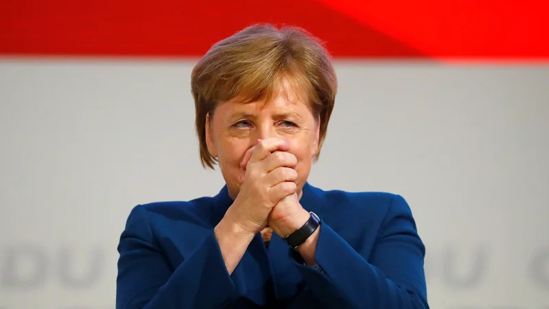 Nemška kanclerka Angela Merkel na kongresu stranke. FOTO: Fabrizio Bensch/Reuters