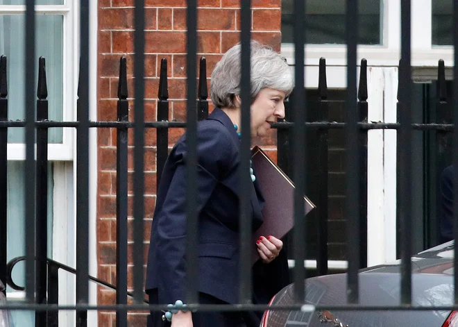 Britanska premierka Theresa May bo morda že danes odpotovala v Bruselj. FOTO: REUTERS/Phil Noble