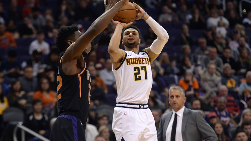 Fotografija: Jamal Murray je kljub poškodbi gležnja zadel kar devet trojk. FOTO: Joe Camporeale/Reuters
