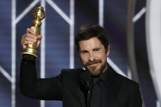 Zlati globus za glavno moško vlogo v glasbenem filmu ali komediji je dobil Christian Bale (Mož iz ozadja). FOTO: Reuters