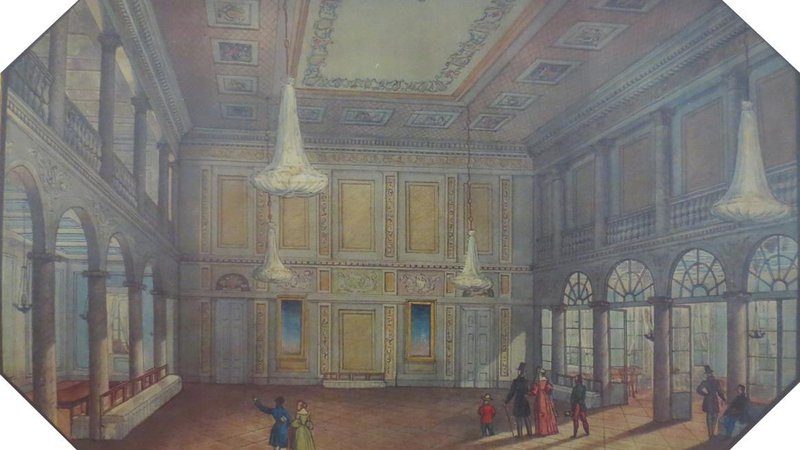 Fotografija: Plesna dvorana v ljubljanski Kazini na severnem delu Kongresnega trga leta 1839 (litografija). Wikipedija. Na vzhodnem delu Kongresnega trga pa je bilo nemško stanovsko gledališče.  Foto Wikipedija