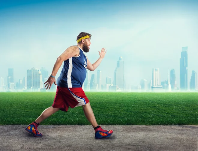 Fat sportsman running in the open air