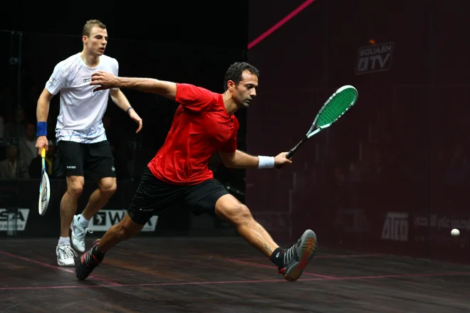 LONDON, ENGLAND - JANUARY 05: Amr Shabana (EGY) in action against Nick Matthew (ENG) in the final of the ATCO World Series Finals 2012, being played on January 6th 2013 at the Queens Club, London. (Photo by Jordan Mansfield)