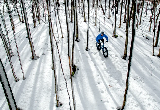 Fat biker riding his bicycle in the snow during Canadian winter