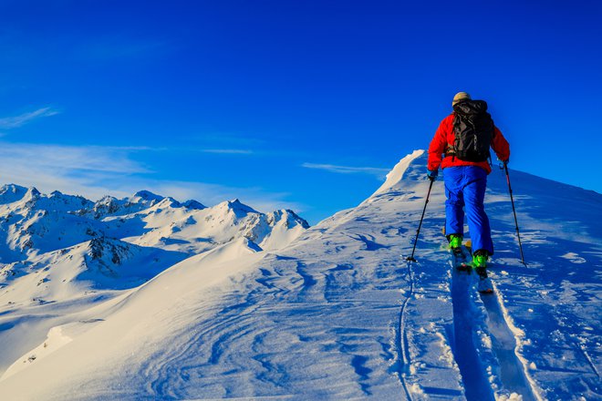 Ski with amazing view of swiss famous mountains in beautiful winter snow Mt Fort. The skituring, backcountry skiing in fresh powder snow.