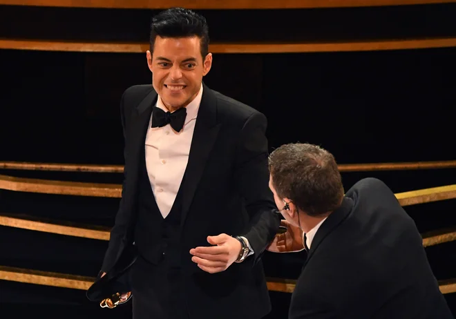 Rami Malek je prejel nagrado za najboljšo moško vlogo. FOTO: AFP