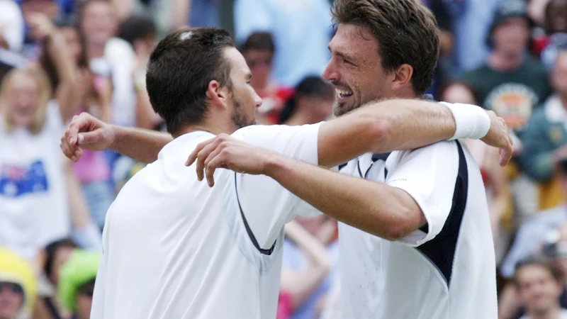 Fotografija: Goran Ivanišević in Patrick Rafter sta pred 18 leti v Wimbledonu odigrala nepozaben dvoboj. FOTO: Reuters
