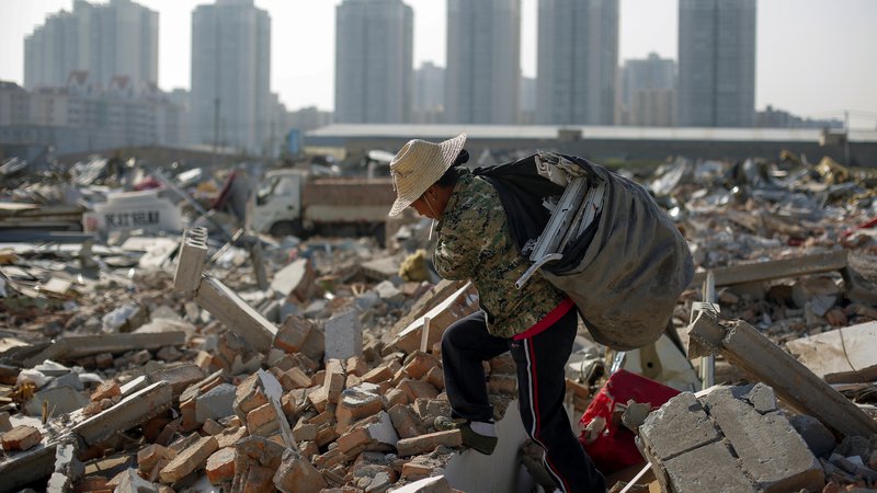 Fotografija: Kitajska zdaj tudi drugim ponuja svoj model boja proti revščini. FOTO: Thomas Peter/Reuters