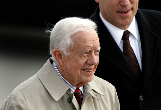 Jimmy Carter je leta 2002 prejel Nobelovo nagrado za mir. FOTO: Joshua Lott/Reuters