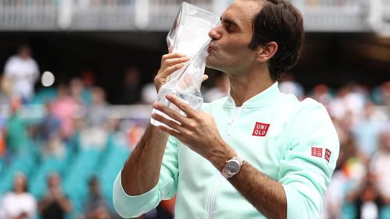 Fotografija: V Miamiju je Roger Federer lovoriko poljubil že četrtič. FOTO: Al Bello/AFP