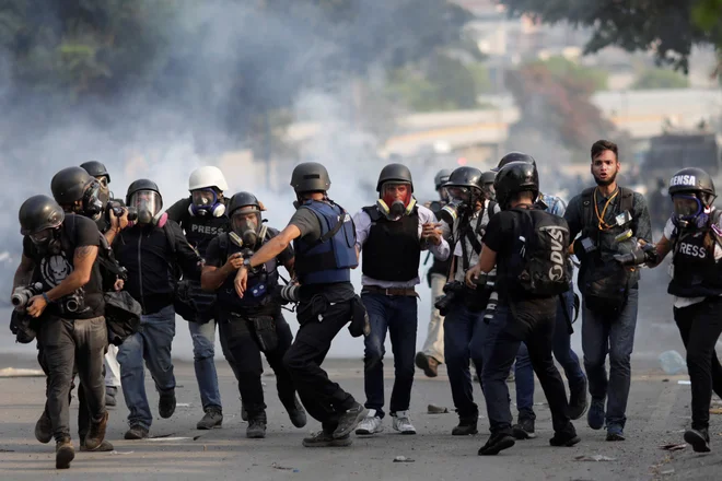 Umrli so že trije protestniki. FOTO: Ueslei Marcelino/Reuters