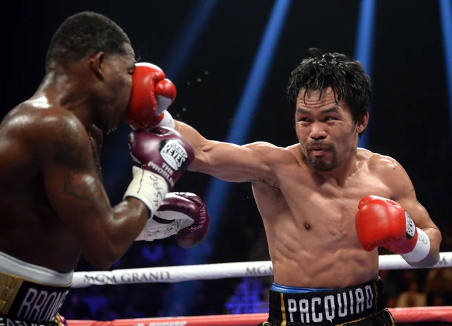 Manny Pacquiao (desno) je s prepričljivo januarsko zmago nad Adrienom Bronerjem dokazal, da še zdaleč ni za staro šaro. FOTO: USA Today Sports