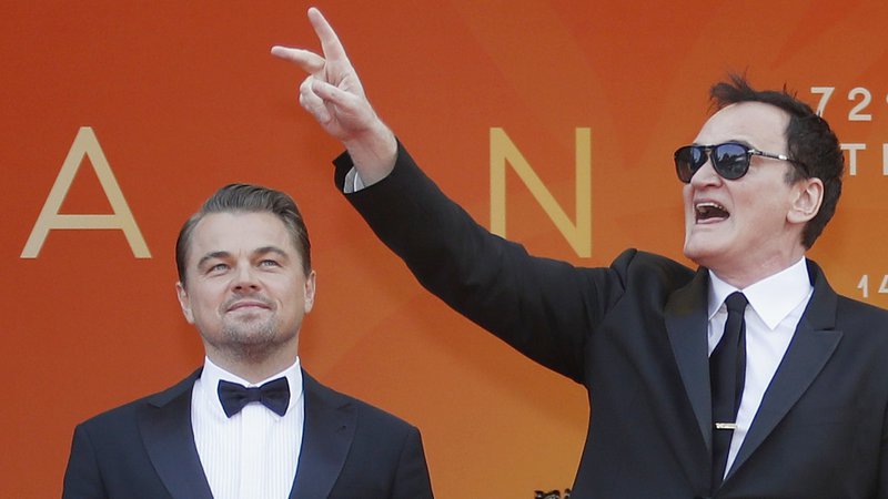 Fotografija: Režiser Quentin Tarantino in igralec Leonardo DiCaprio. FOTO: Eric Gaillard Reuters