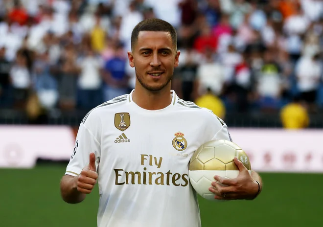 Eden Hazard ob prihodu v Madrid ni skrival dobre volje. FOTO Reuters