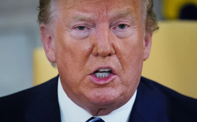 Predsednik Trump med zadnjo iransko krizo. FOTO: Mandel Ngan/Afp