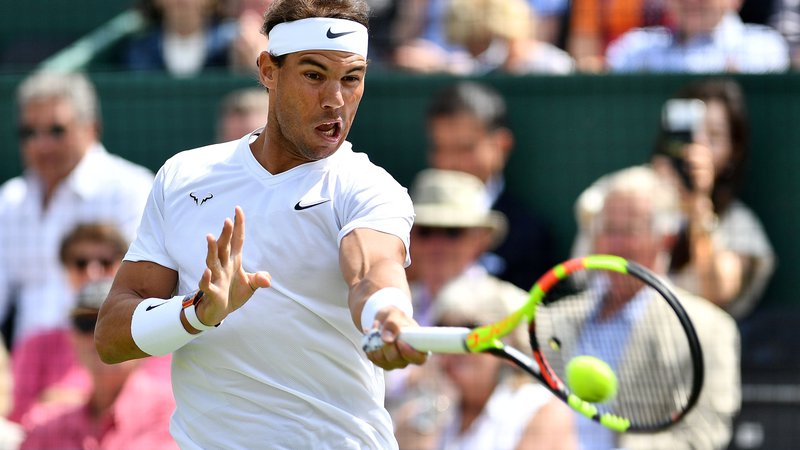 Fotografija: Rafael Nadal se je nazadnje za Wimbledon na travnatih turnirjih pripravljal leta 2015, tudi letos po OP Francije ni igral. FOTO: AFP