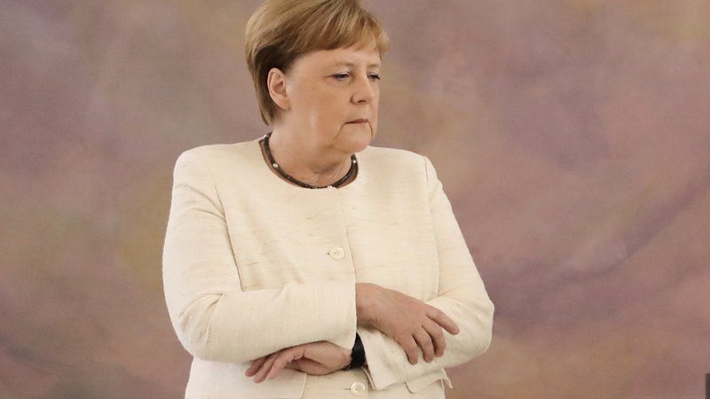 Fotografija: Nemška kanclerka Angela Merkel je znova sprožila govorice o svojem zdravju. FOTO: Kay Nietfeld/Afp
