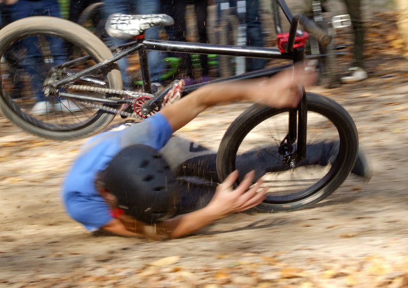 Fotografija: Man falls Off BMX Bike on Track.